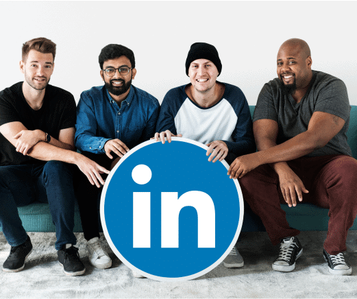 LinkedIn users holding the LinkedIn logo